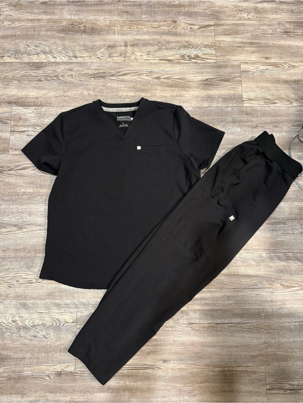 Fabletics Black Short Sleeve V-neck Scrub Top with scrub bottoms